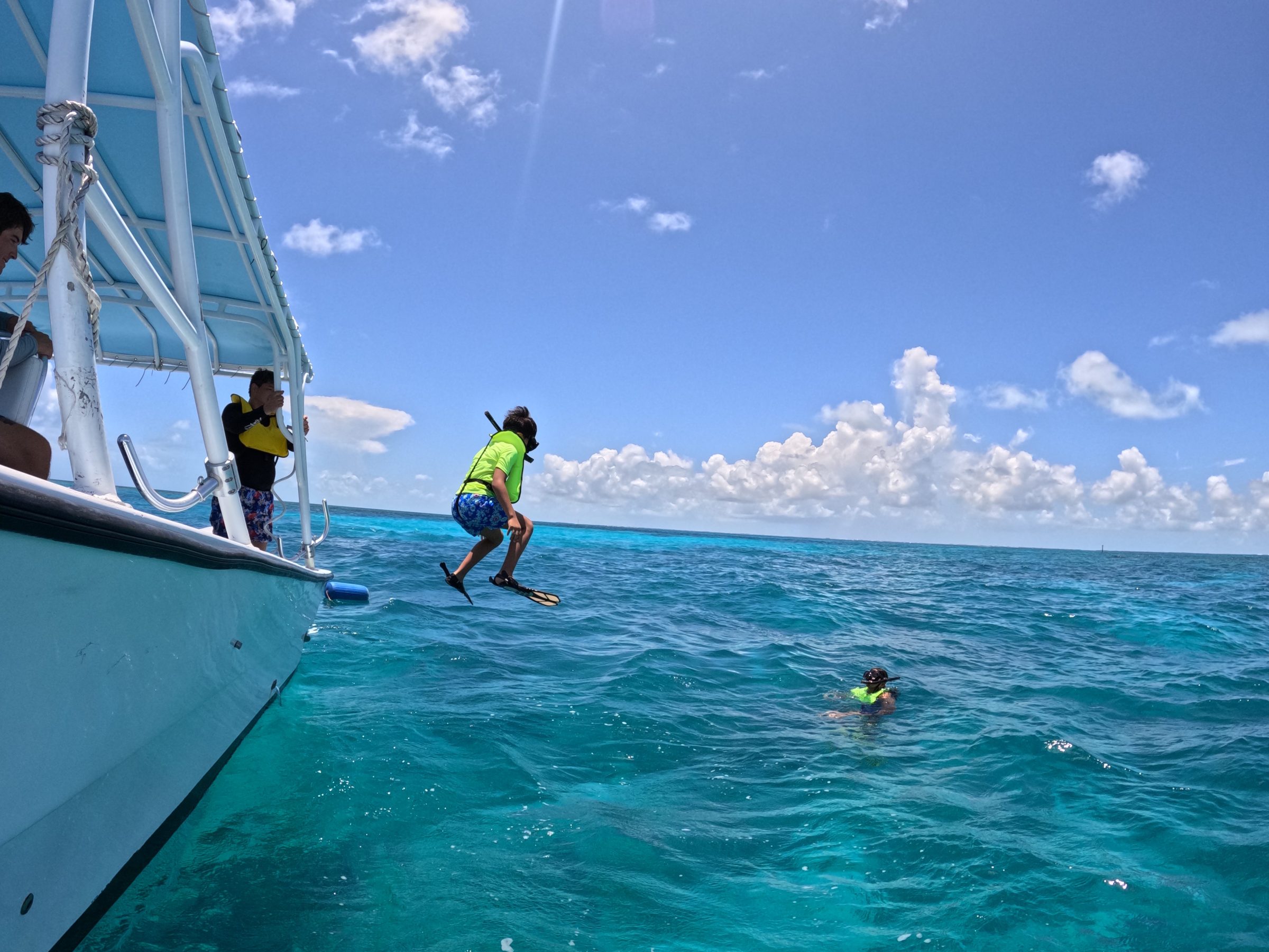 a group of people on a boat in the water