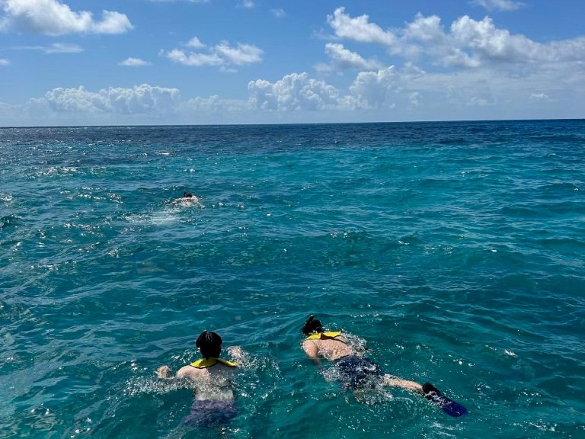 a man riding a wave on a surfboard in the ocean