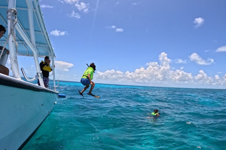 a group of people on a boat in the water